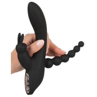 Triple G-Punkt Vibrator in schwarz in einer Hand gehalten